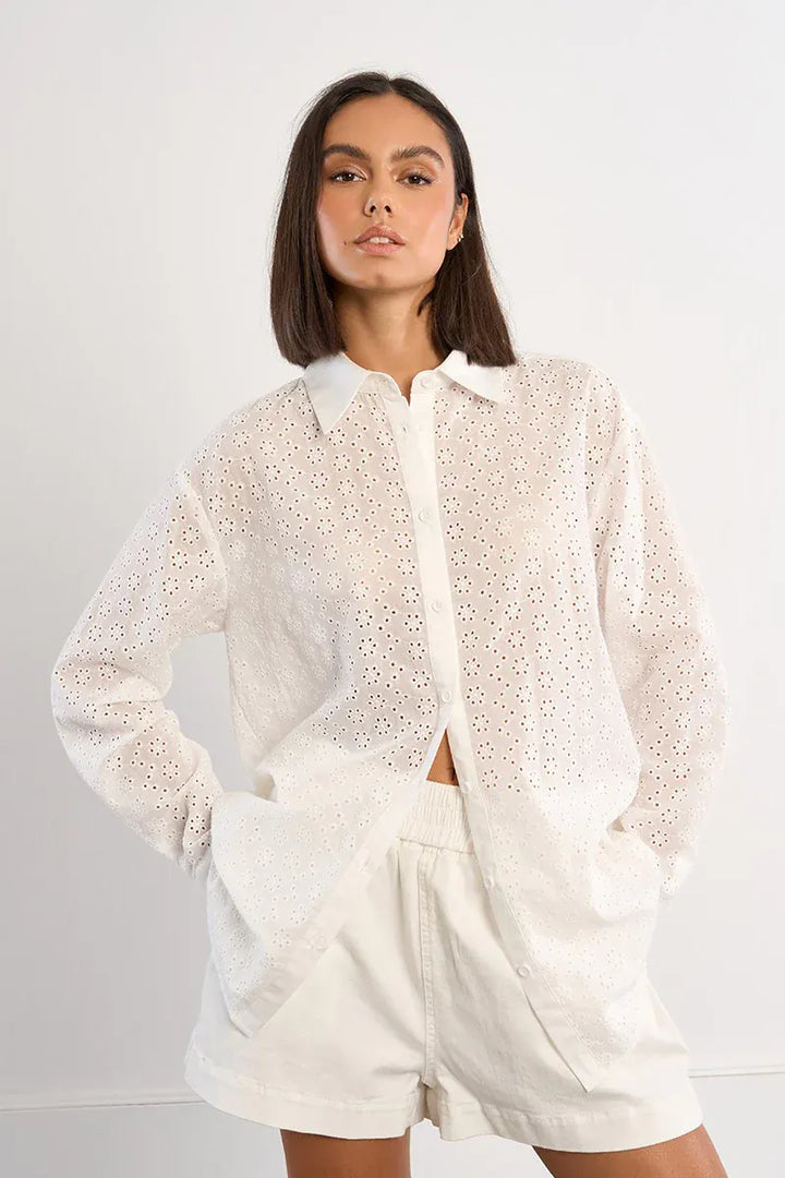 White Molly Bracken Sutton Eyelet Top made of lightweight fabric, featuring eyelet details, shown on a petite model.