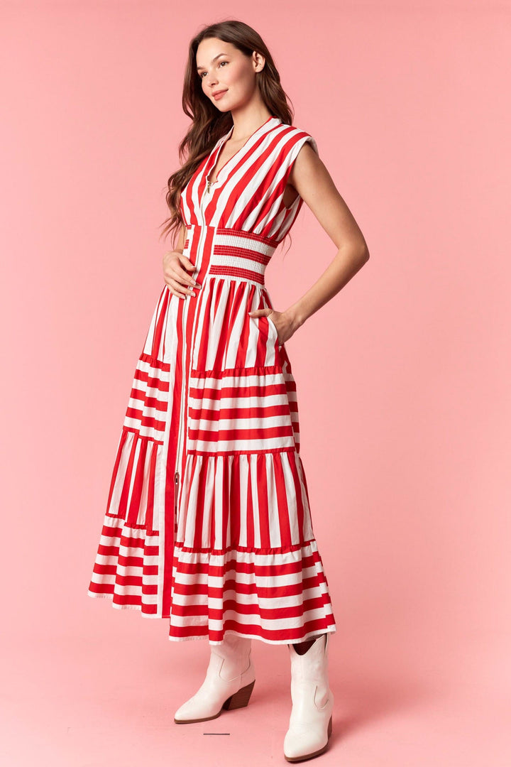 Eliza striped maxi dress by Peach Love California featuring a flowing design with bold vertical stripes and a comfortable fit.