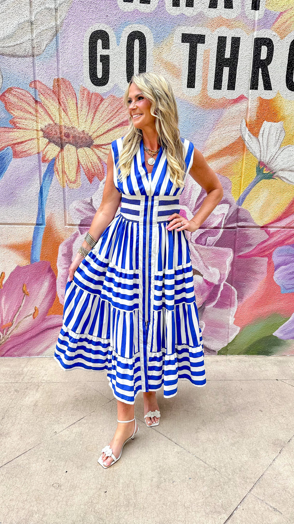 Eliza striped maxi dress by Peach Love California featuring a flowing silhouette and vibrant vertical stripe pattern.