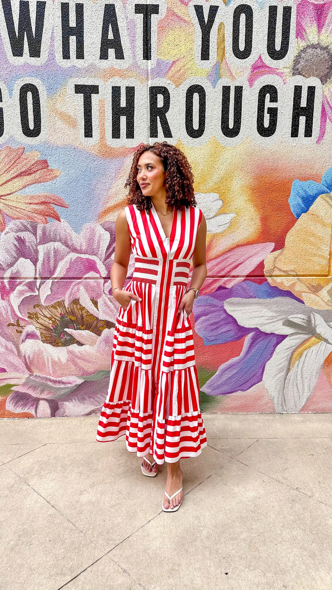 Eliza striped maxi dress by Peach Love California displayed on a model, featuring a flowing silhouette and vibrant stripe pattern.