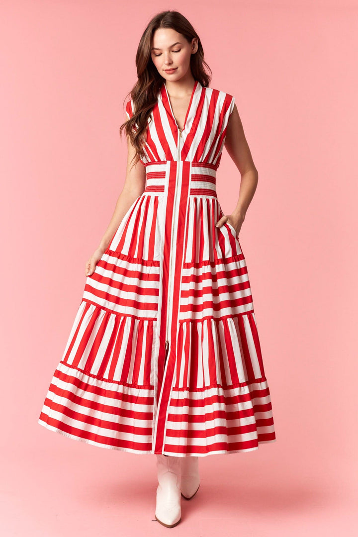 Red Eliza Striped Maxi Dress by Peach Love California, flowing fabric with bold stripe pattern and sleeveless design.