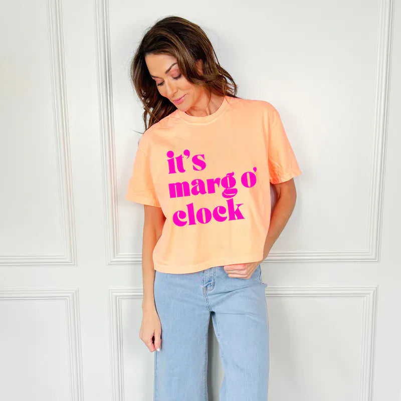 Poppy & Pine Marg O'Clock Crop Tee, neon cantaloupe graphic graphic tee, front view showing crop fit and vibrant design