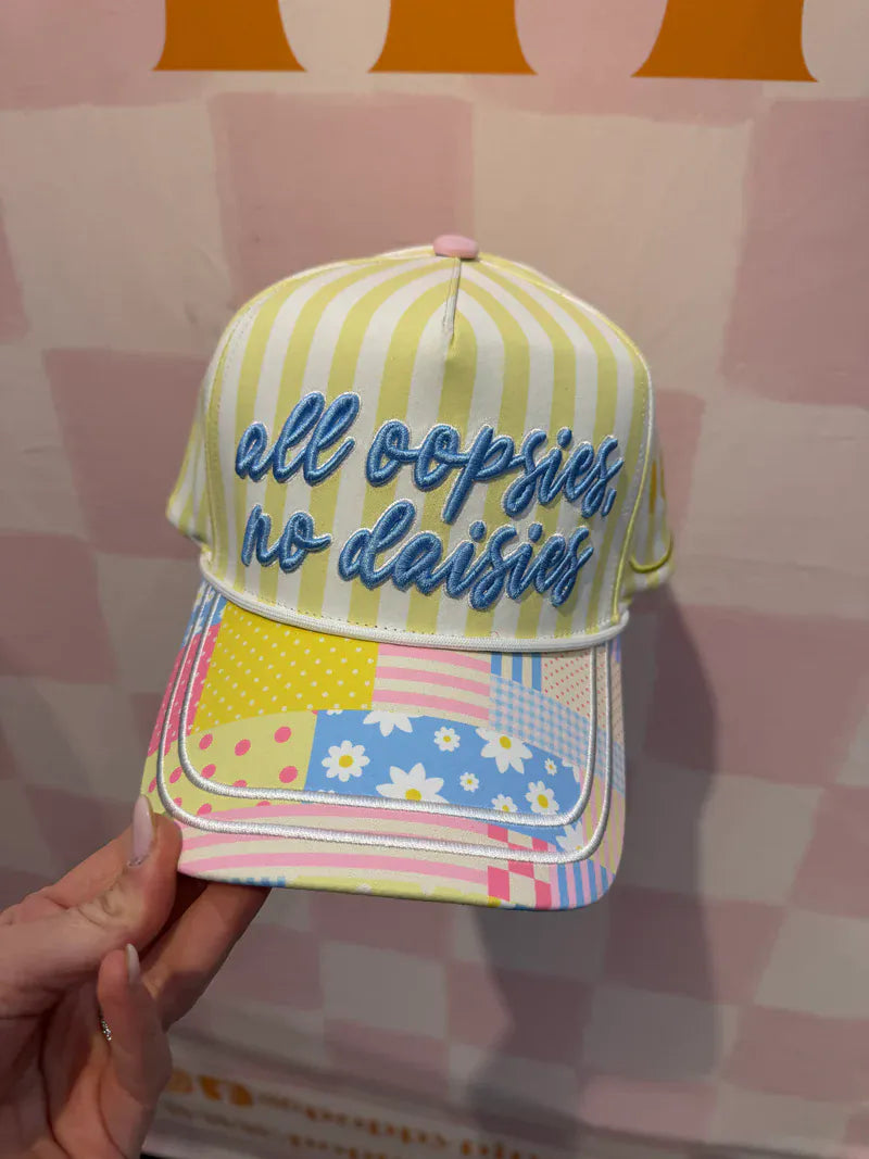 Poppy & Pine All Oopsies No Daisies trucker hat with mesh back and embroidered front panel featuring playful design.