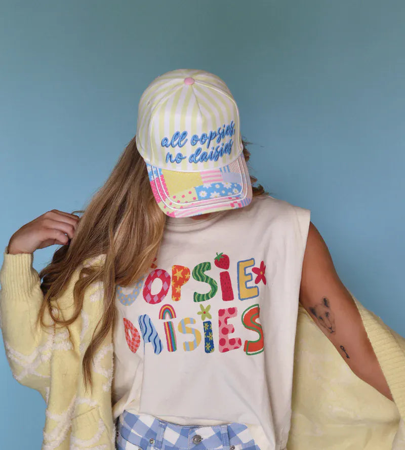 Poppy & Pine trucker hat with "All Oopsies No Daisies" embroidered patch, adjustable mesh back, casual outdoor style.