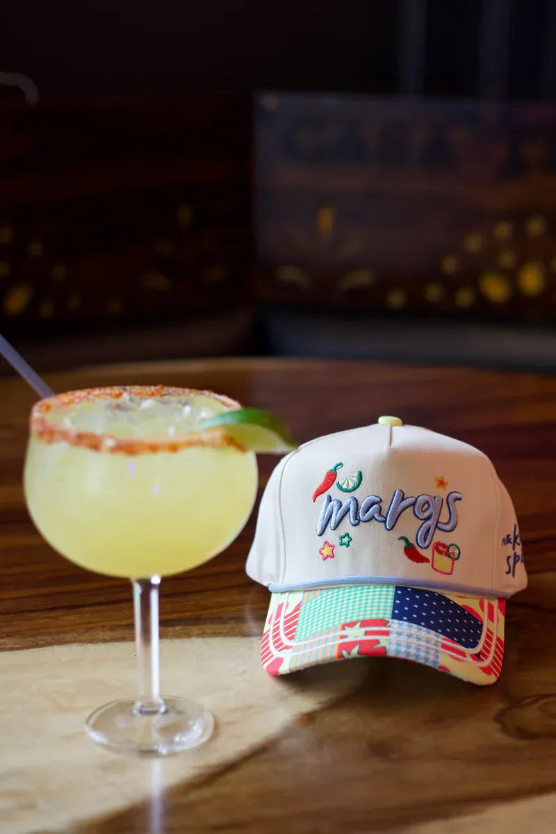 Poppy & Pine Make It Spicy Margs trucker hat with colorful embroidered design and adjustable snapback closure.