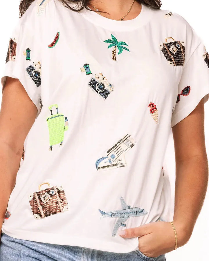 Queen of Sparkles Travel Icon Tee featuring a stylish travel-themed graphic on a comfortable casual T-shirt.