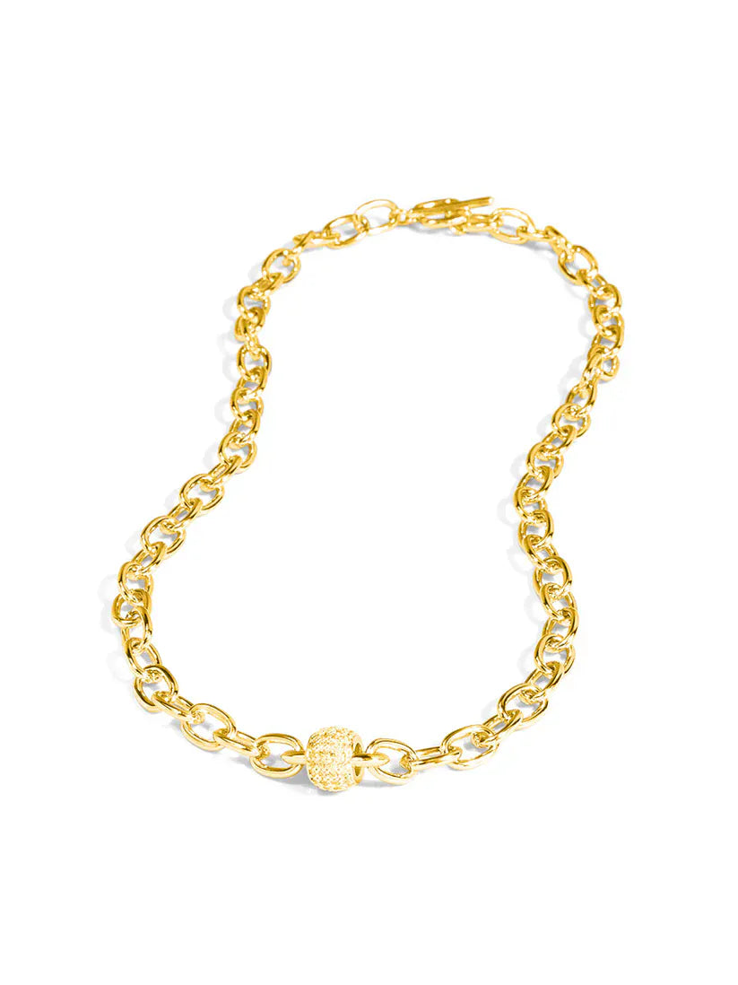 RHO Jewelry pave barrel chain toggle necklace featuring a sleek, gold-tone design with textured barrel links and a secure toggle clasp.