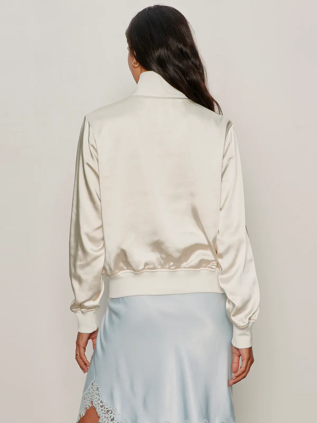 Sanctuary Gemma Satin Track Jacket featuring a sleek design, shiny satin fabric, and sporty style with a zip front and ribbed cuffs.