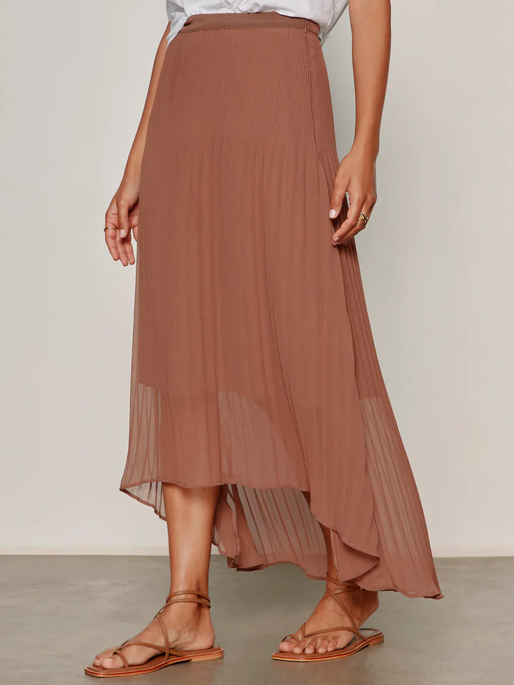 Sanctuary Meant To Be pleated midi skirt with flowy fabric and high waist, styled for a versatile, elegant look.
