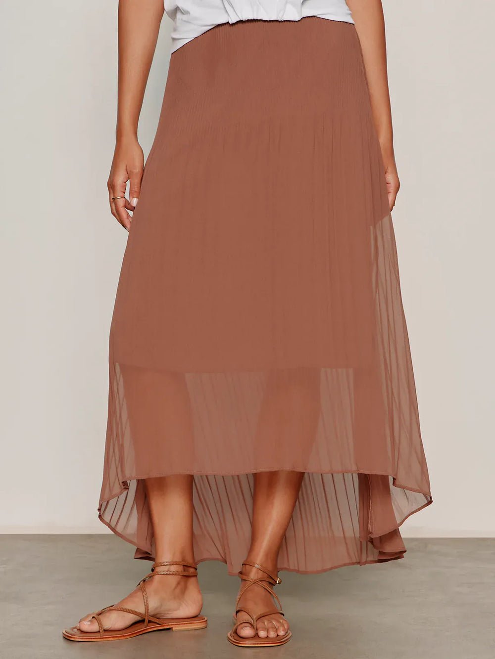 Sanctuary Meant To Be Pleated Midi Skirt in mud color, showing a flowy, pleated design perfect for casual or dressy outfits.