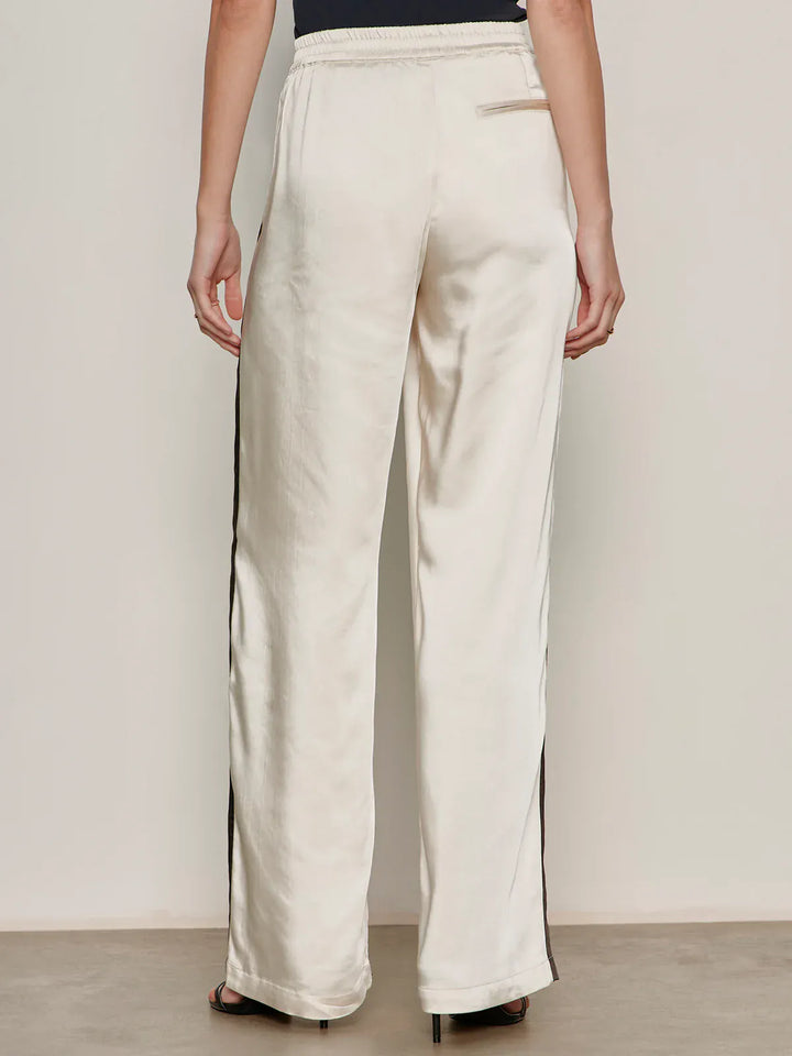 Sanctuary Angel Satin Track Pant showing a relaxed fit, satin fabric, and elastic waistband in a neutral color.