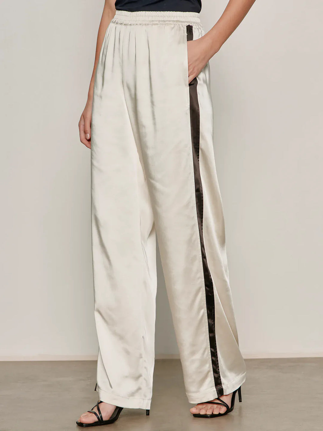 Sanctuary Angel Satin Track Pants in collagen color, featuring a relaxed fit and satin fabric for casual comfort.