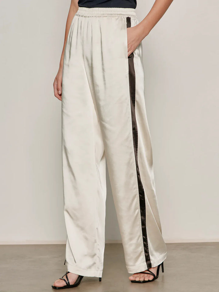 Sanctuary Angel Satin Track Pants in collagen color, featuring a relaxed fit and satin fabric for casual comfort.
