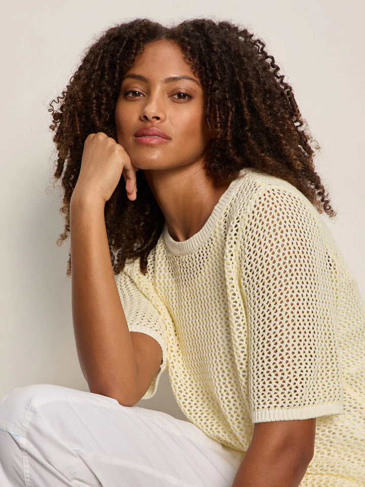 Light grey Sanctuary open knit sweater tee, featuring a relaxed fit with a breathable, open-knit design perfect for casual wear.