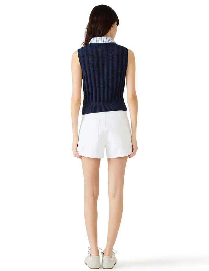 Steve Madden Embree Sweater Vest displayed on a model, featuring a cozy knit design and classic fit for stylish layering.