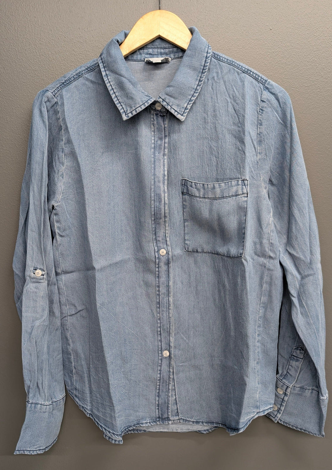 Medium blue Stitch &amp; Co. Avery button-down top with collar and long sleeves, displayed flat on a white background.