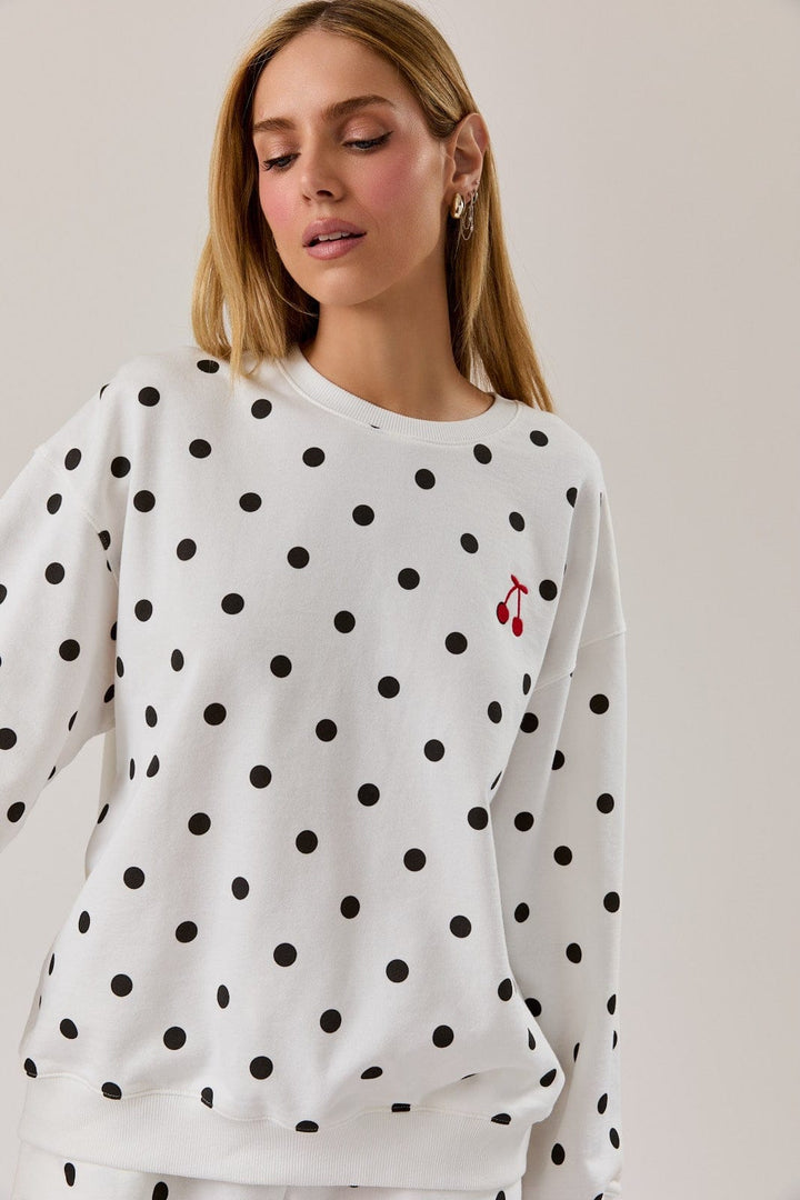 Sunday Edition Claire Polka Dot Sweatshirt, cozy loungewear with black and white polka dots, soft fabric and relaxed fit.