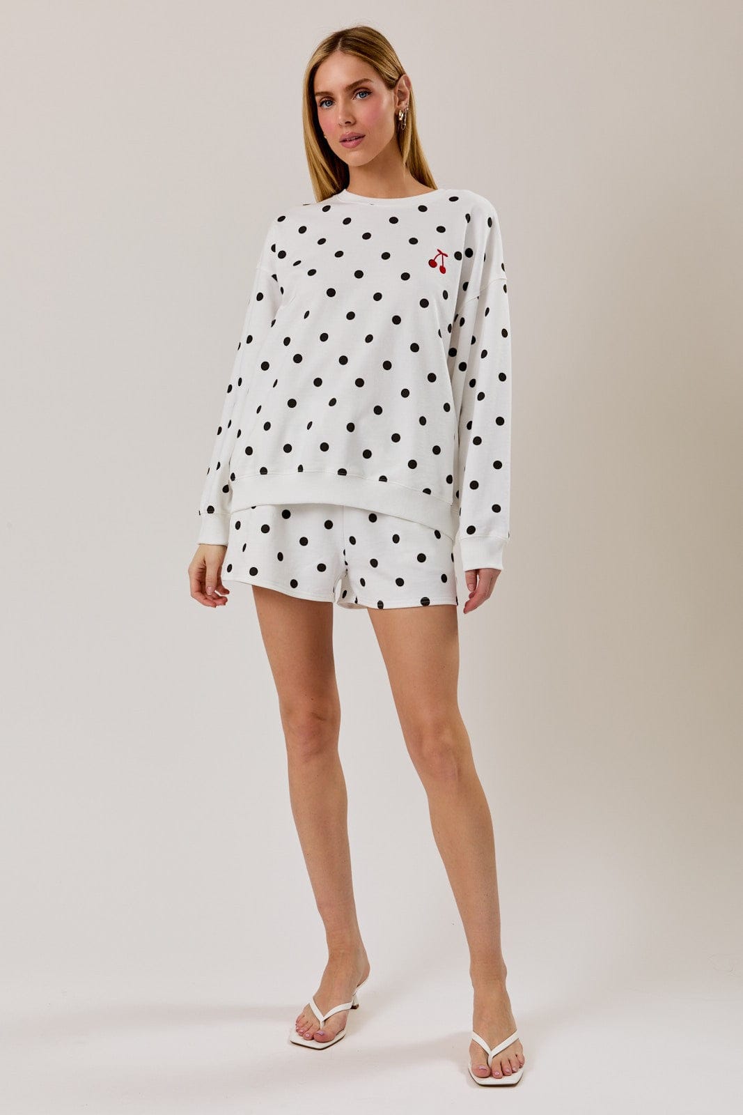 Sunday Edition Claire Polka Dot Sweatshirt, cozy loungewear with black and white polka dots, soft fabric and relaxed fit.