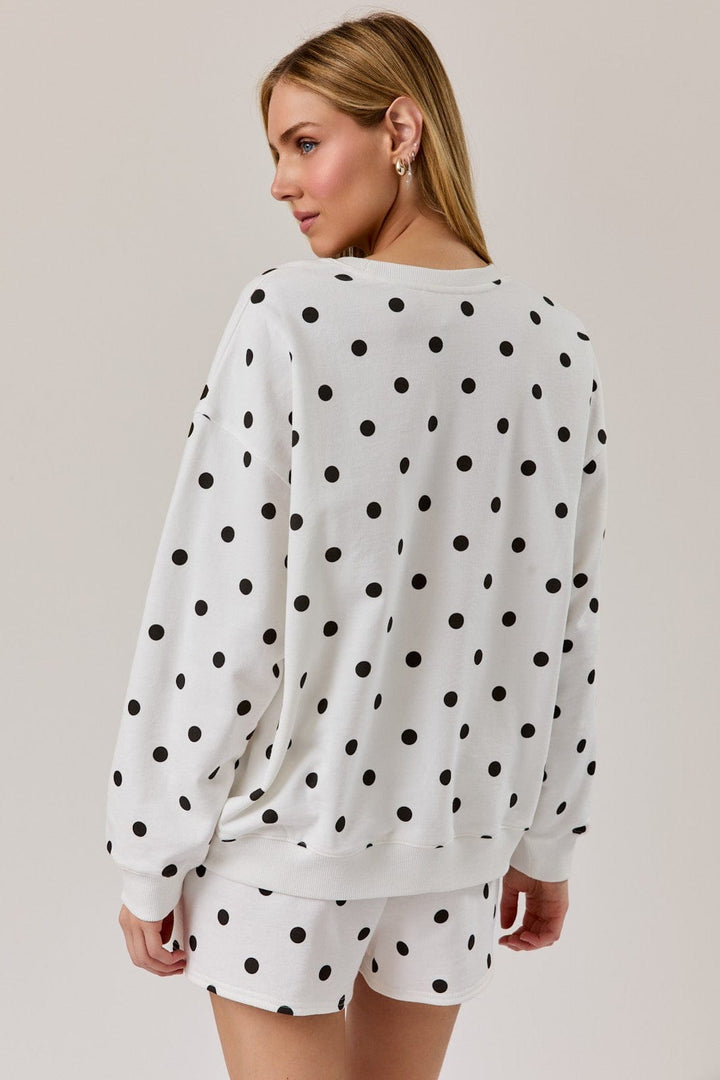 Sunday Edition Claire Polka Dot Sweatshirt, cozy loungewear with a polka dot pattern, shown on a model.
