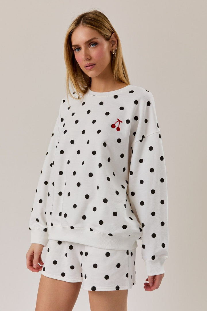 Sunday Edition Claire Polka Dot Sweatshirt, cozy loungewear with black and white polka dots, soft fabric, casual fit.