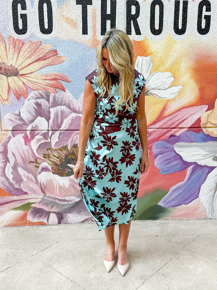 TCEC Lilly floral color block midi dress with a fitted waist, sleeveless design, and vibrant floral pattern on lightweight fabric.