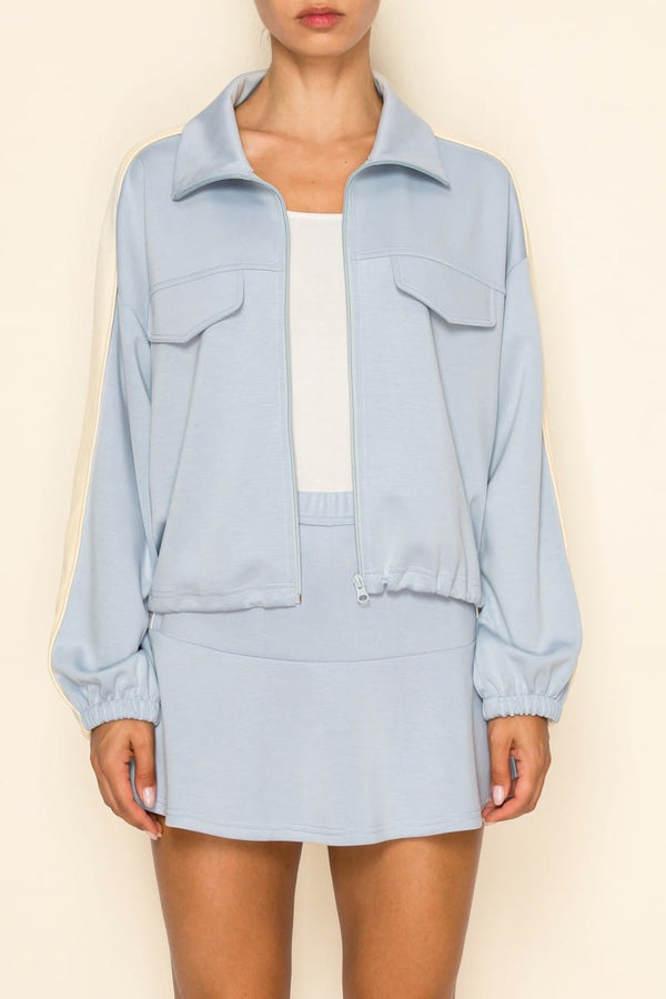 Sky blue Journi Track Set by The Greii, featuring a stylish matching jacket and pants designed for comfort and activewear.