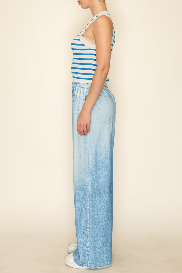 Celia striped tank top by The Greii featuring a sleeveless design with horizontal stripes in various colors.