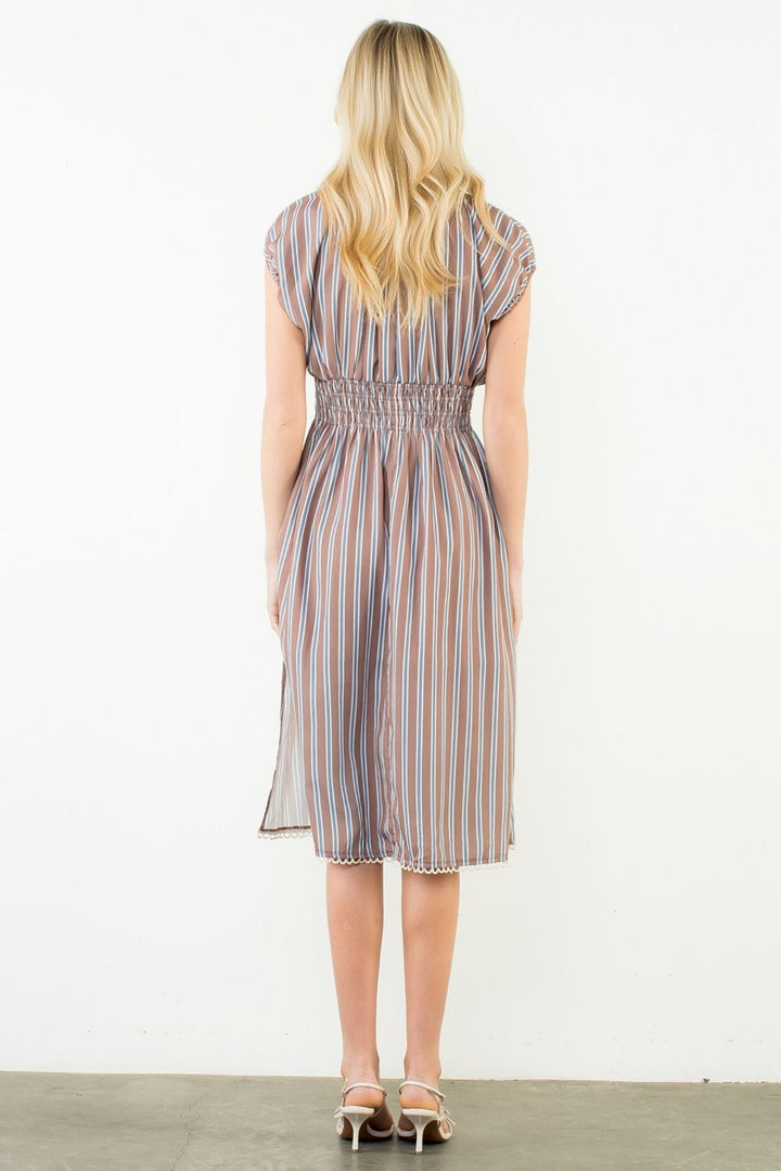 THML Arya striped dress featuring vibrant vertical stripes, sleeveless design, and lightweight fabric for casual wear.