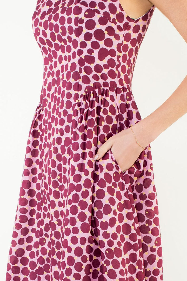 THML Wrenley Dots Midi Dress featuring a stylish dot pattern, sleeveless design, and midi length, perfect for casual or dressy occasions.