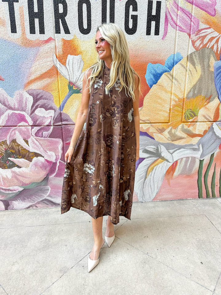 THML Kinsley Tie Back Floral Maxi Dress featuring a vibrant floral pattern and tie-back detail.