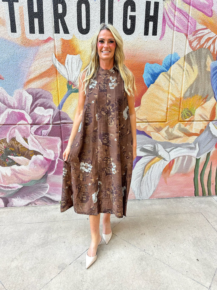 THML Kinsley Tie Back Floral Maxi Dress with ruffled hem and vibrant floral print, perfect for summer or casual occasions.