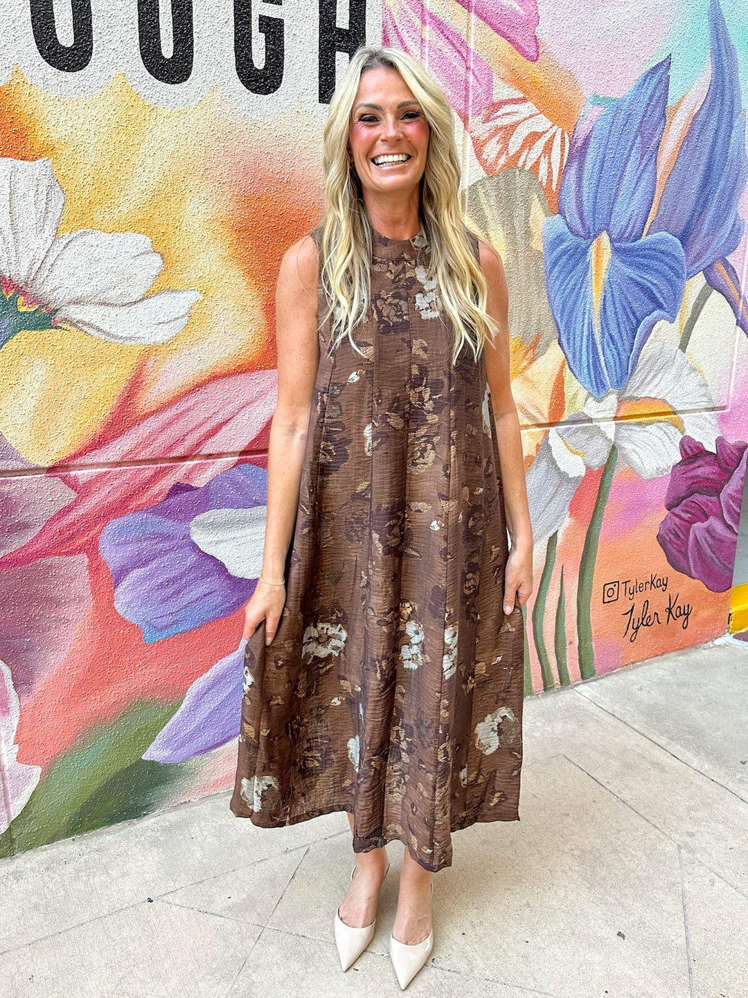 ThML Kinsley floral maxi dress featuring tie-back design and vibrant floral pattern, perfect for summer or casual occasions.