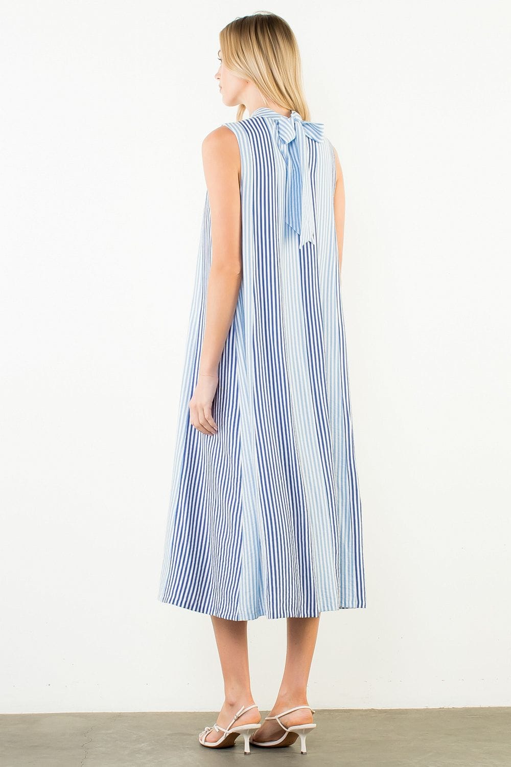 THML Raya striped pattern midi dress featuring a stylish design and vibrant colors, perfect for casual or semi-formal occasions.