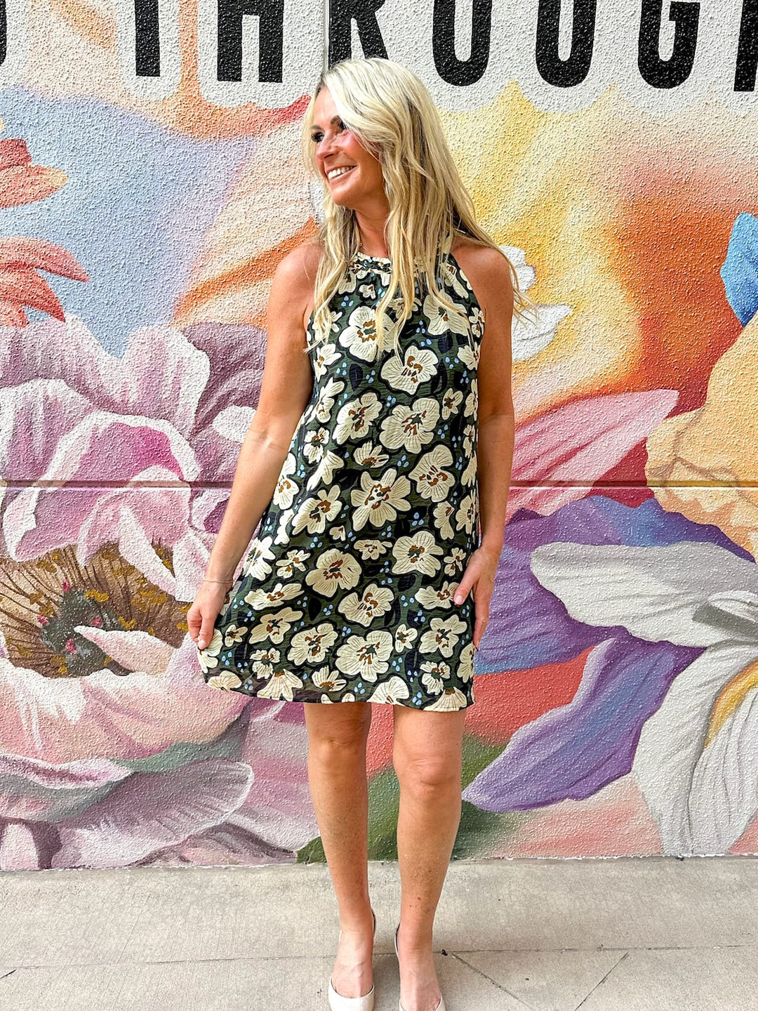 Elsie Floral Halter Mini Dress by THML featuring a vibrant floral pattern and a stylish halter neckline, perfect for summer occasions.
