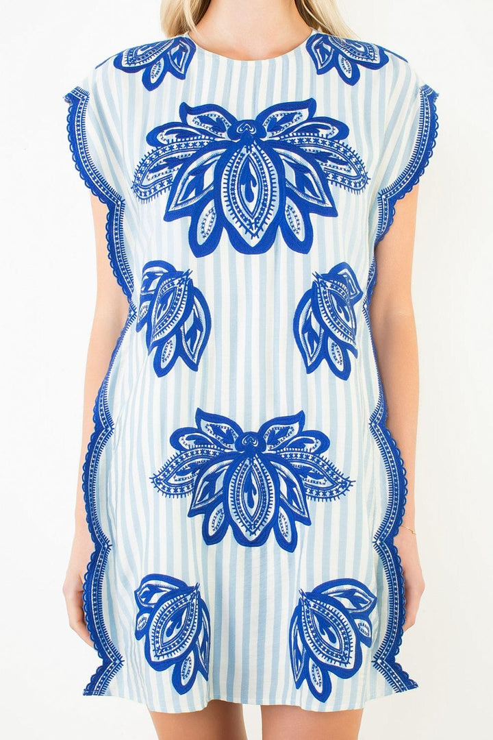 THML Laila striped mini dress featuring a fitted silhouette, short sleeves, and a stylish pattern for casual or dressy occasions.