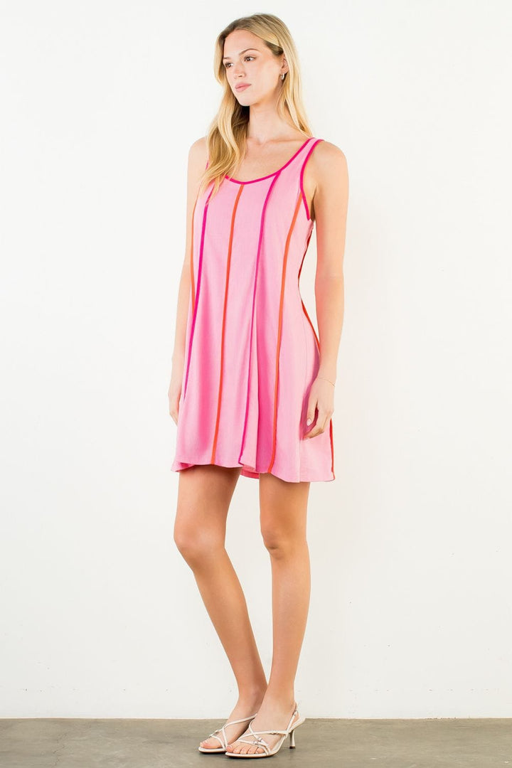 THML Milani striped mini dress featuring a fitted silhouette and vibrant pattern, perfect for casual or summer wear.