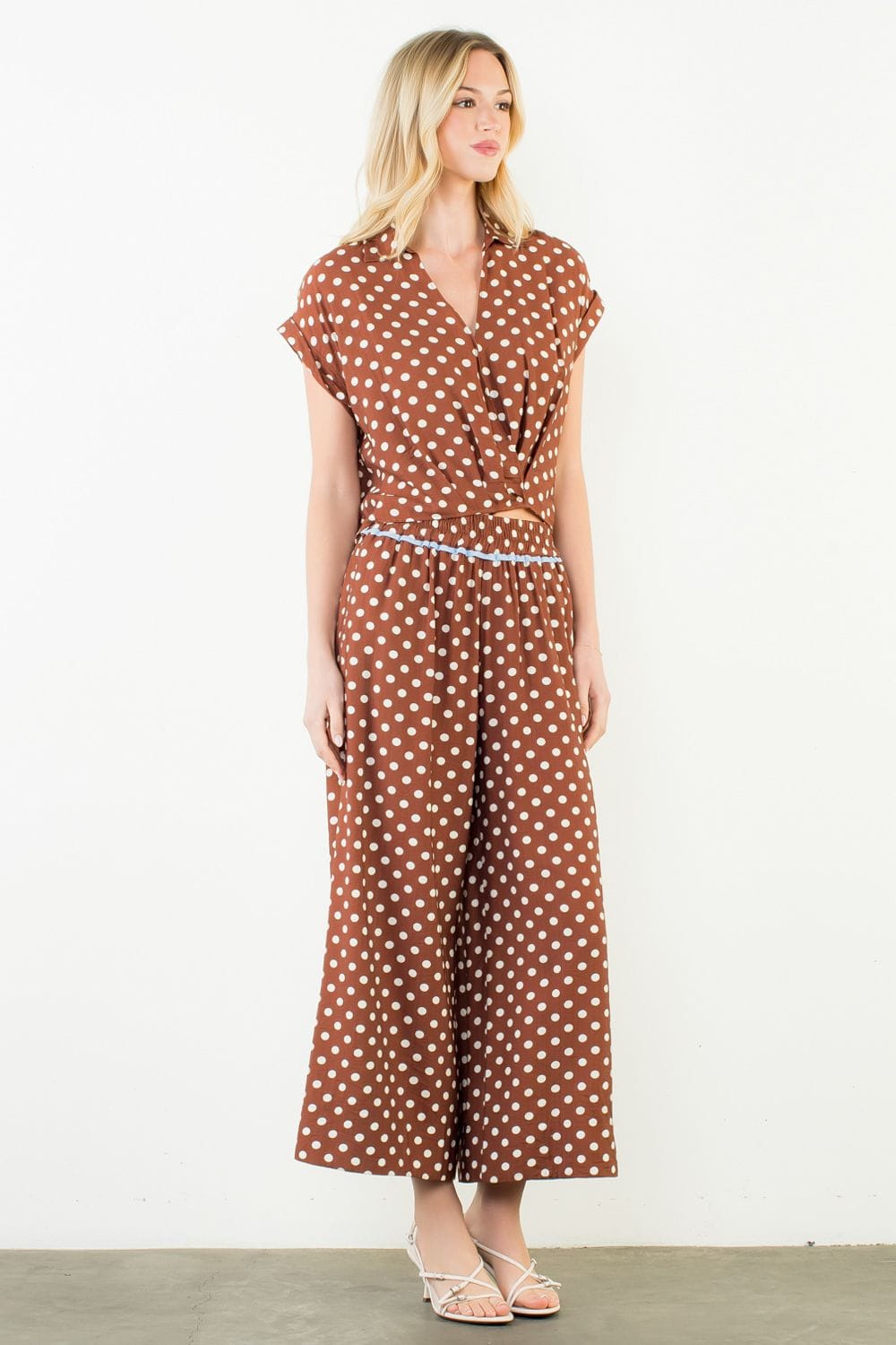ThML Sara Polka Dot Wide Leg Pants featuring a flowy fit, high waist, and black and white polka dot pattern.