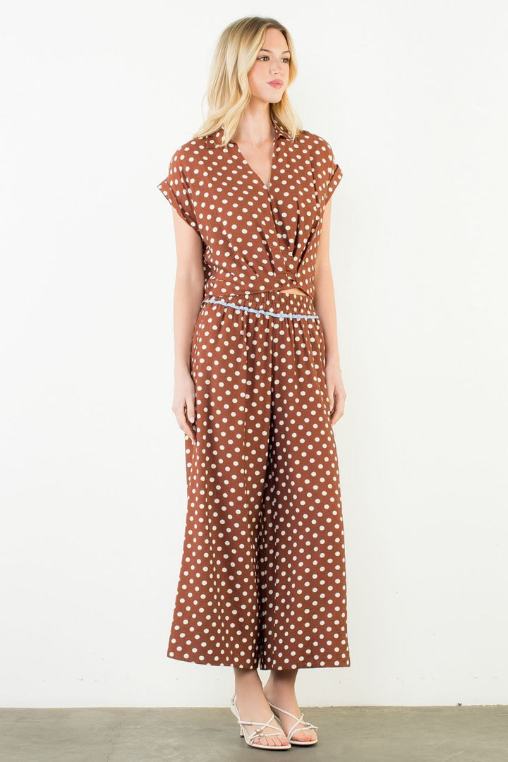 ThML Sara Polka Dot Wide Leg Pants featuring a flowy fit, high waist, and black and white polka dot pattern.