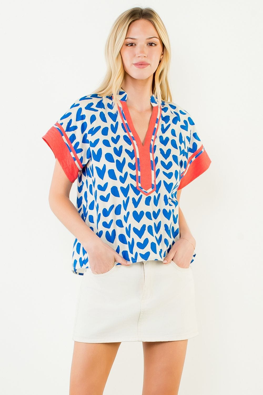 Blue Leia Heart Top by THML, casual sleeveless top with a fitted design and heart-shaped neckline, shown in size XS.