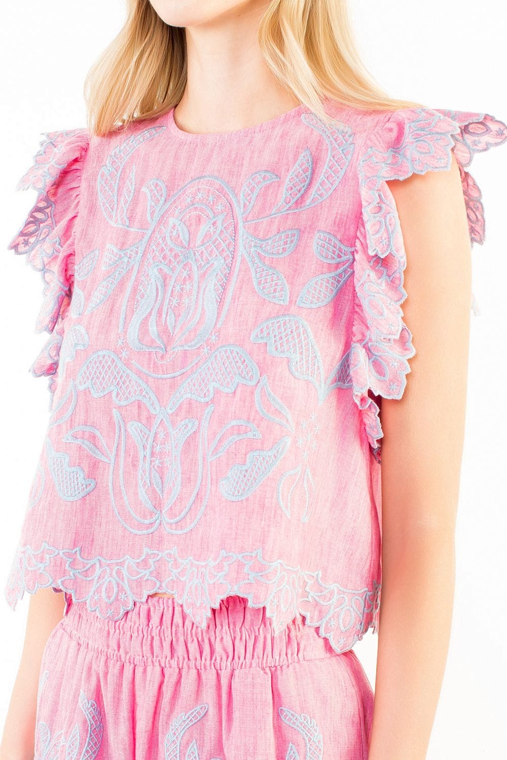 Danna embroidery top by THML featuring intricate floral embroidery, lightweight fabric, and a relaxed fit perfect for casual wear.