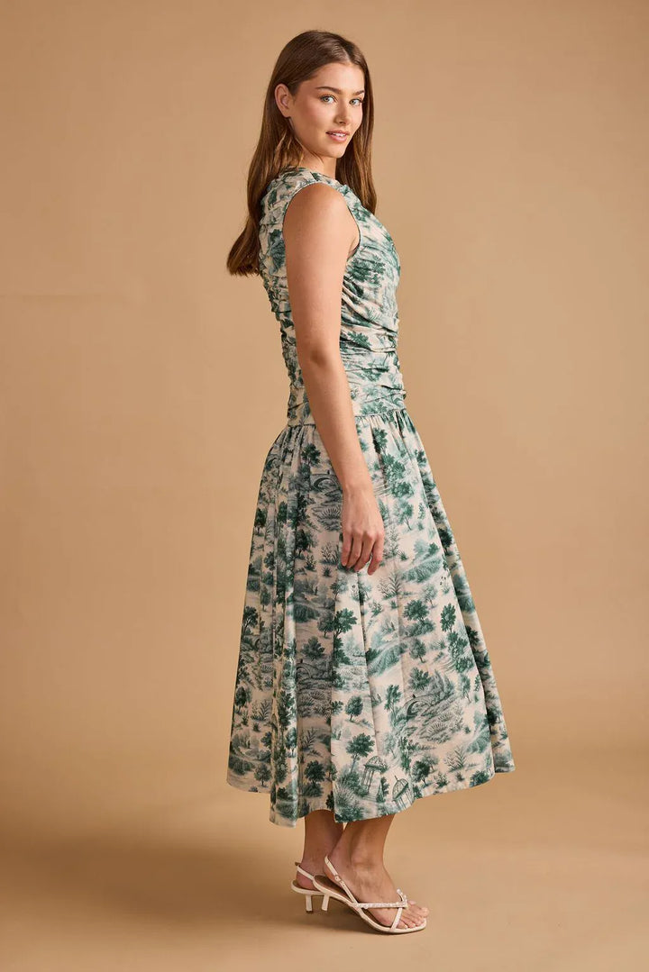 Thomas &amp; Lourdes Agatha Maxi Dress in flowing fabric, featuring elegant design and vibrant colors, perfect for summer wear.