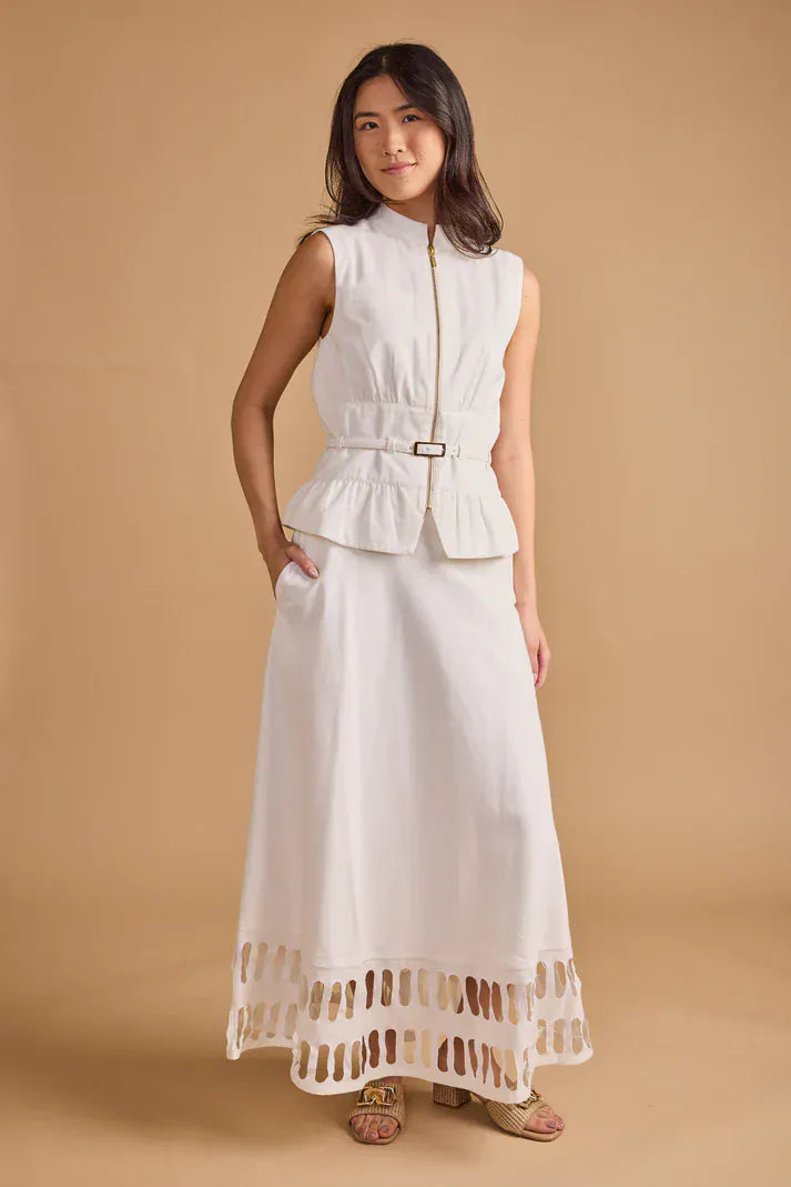 Cream Thomas & Lourdes Lior Vest displayed on a hanger, showcasing a stylish vest with a fitted design and textured fabric.