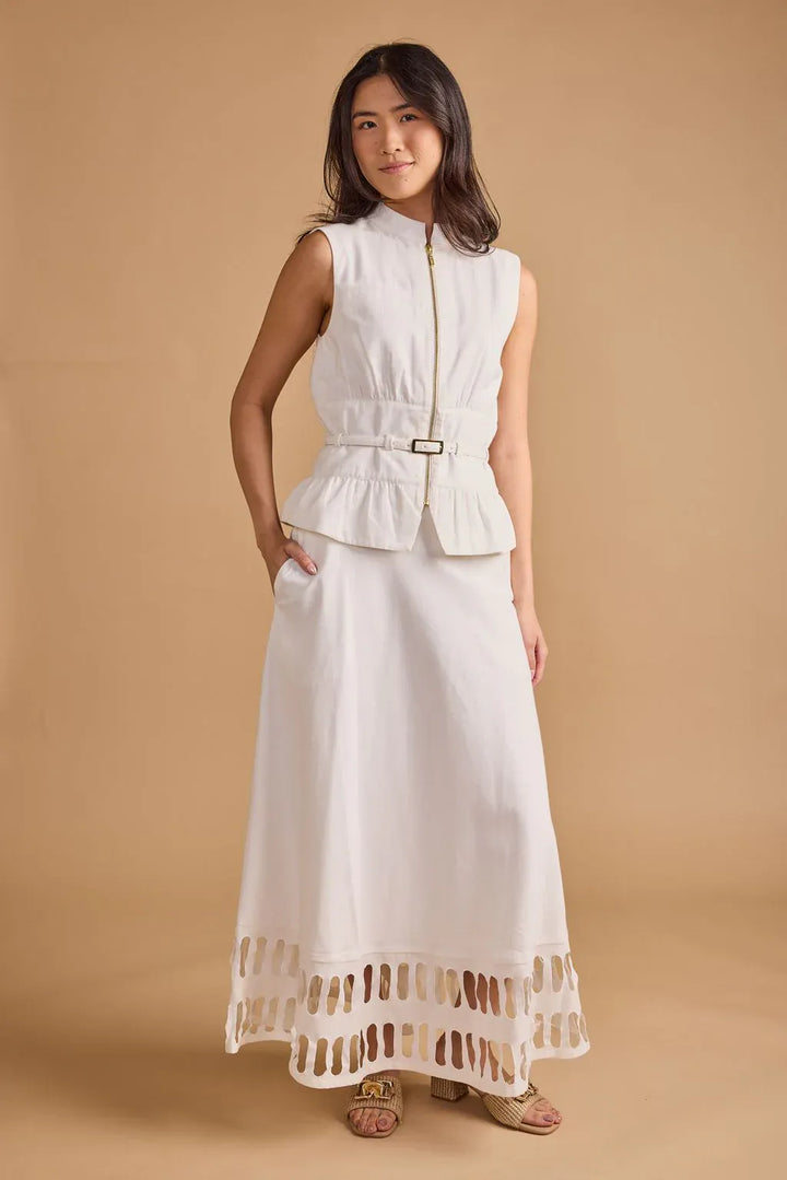 Thomas &amp; Lourdes Lior vest, stylish sleeveless outerwear in neutral fabric, displayed on a hanger.