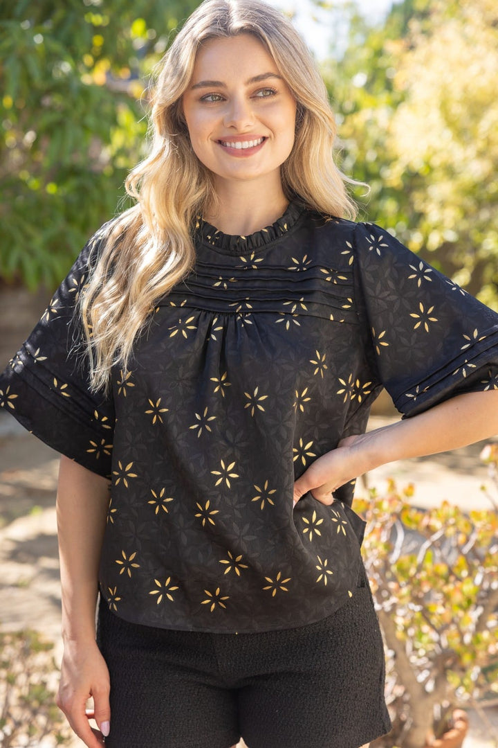 Voy Emely metallic floral top in black, featuring a shimmering floral pattern and short sleeves