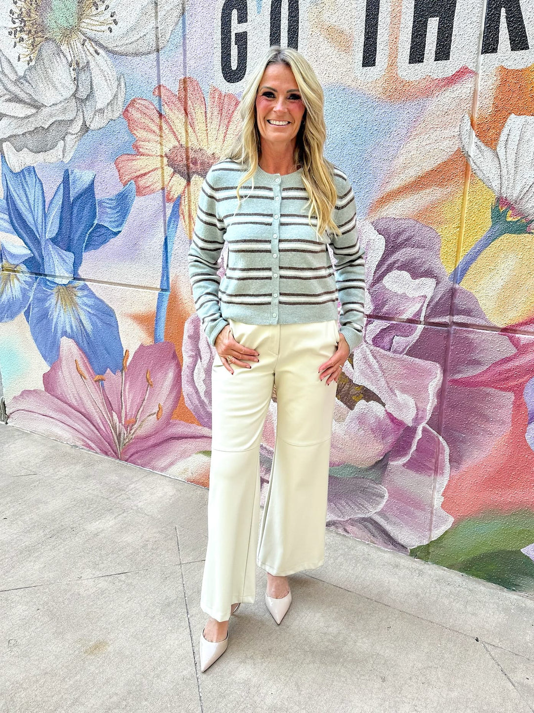 Z Supply Medina Cozy Stripe Cardigan featuring soft fabric and colorful stripe pattern, displayed on a hanger.